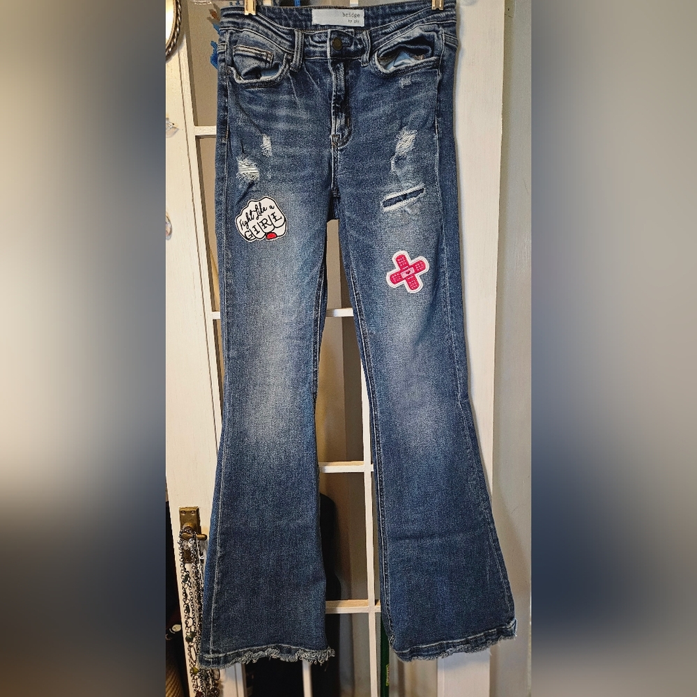 Embellished Blue Flare Jeans with Patch Details